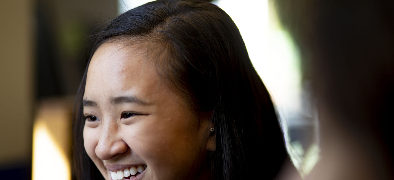A young student smiling.