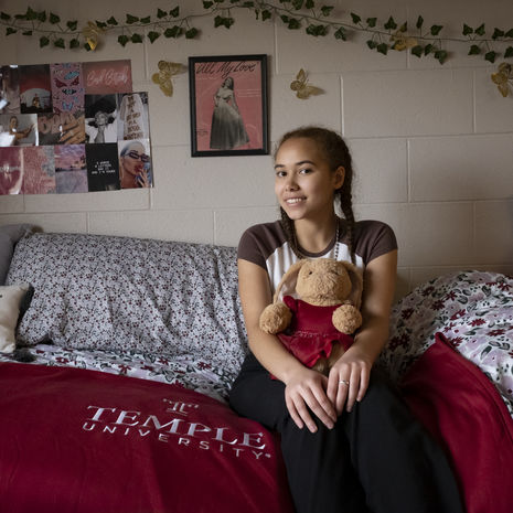 student posing in her dorm room.