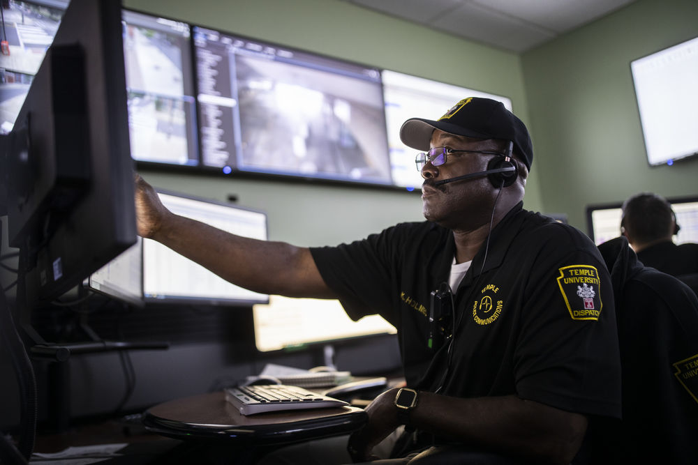 one of Temple's security staff checking safety camera footage.
