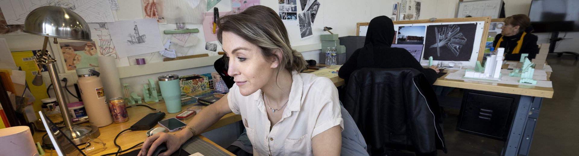 students work on their laptops in class.